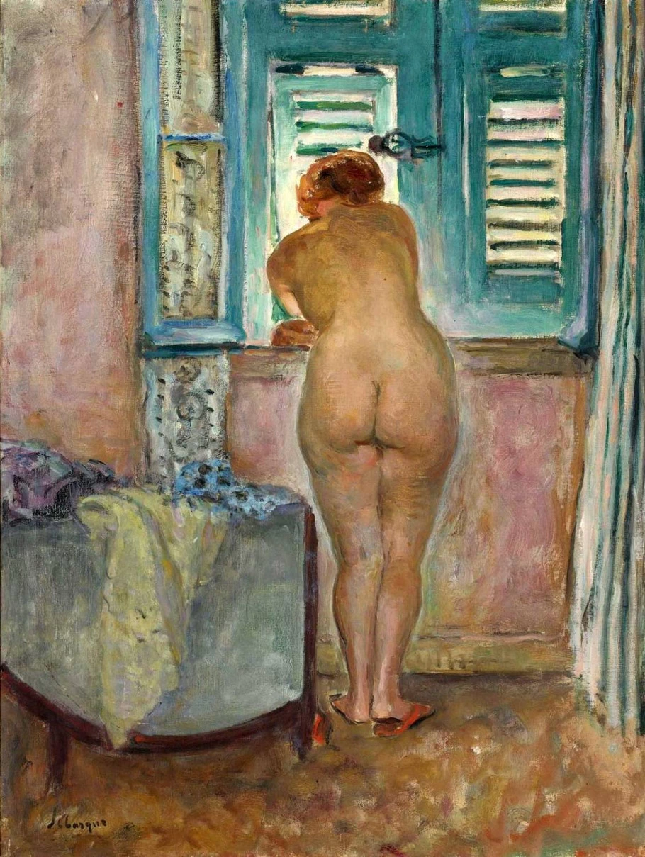 Nuda di schiena alla finestra